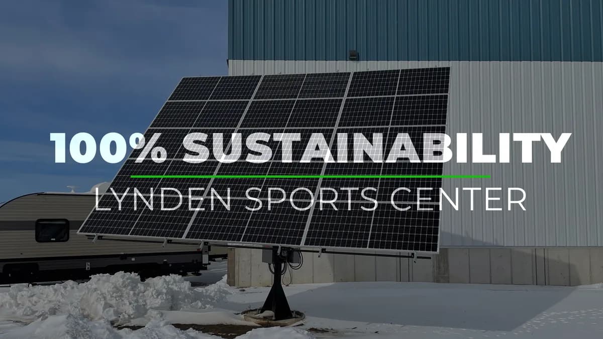Solar panels at Lynden Sports Center with the original 100% sustainability headline