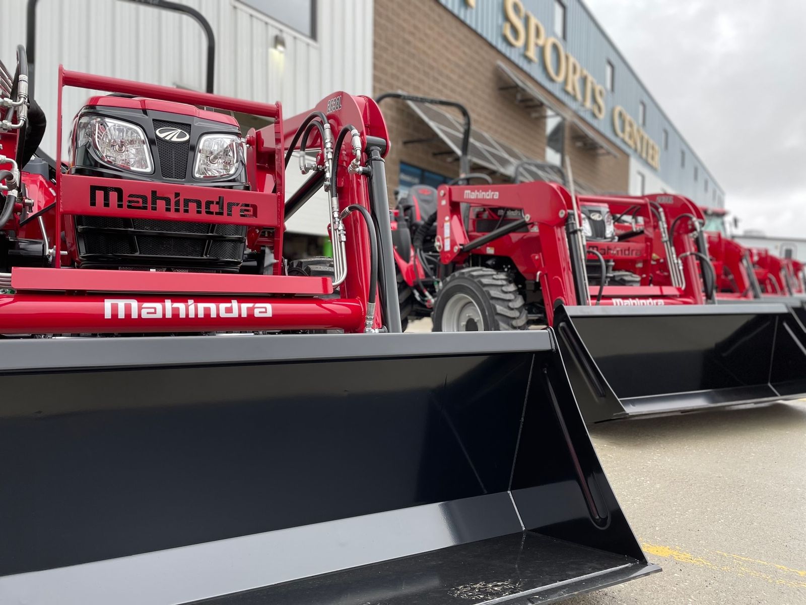 Mahindra tractors lined up on the Lynden Equipment lot